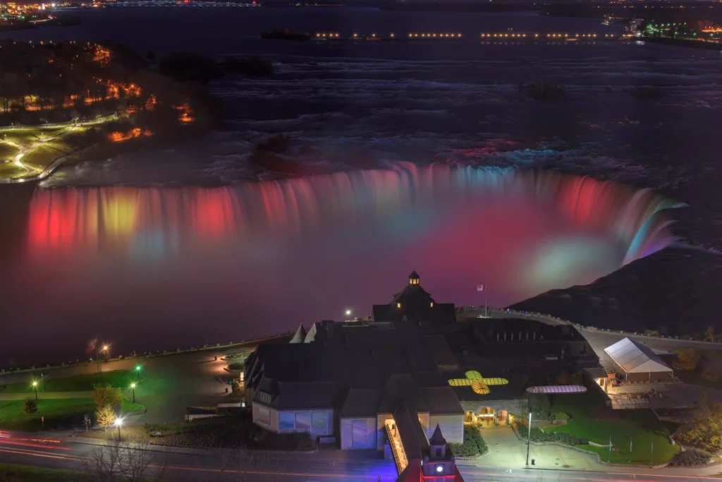 Nighttime view of Niagara Falls illuminated, Skylon Tower observation
